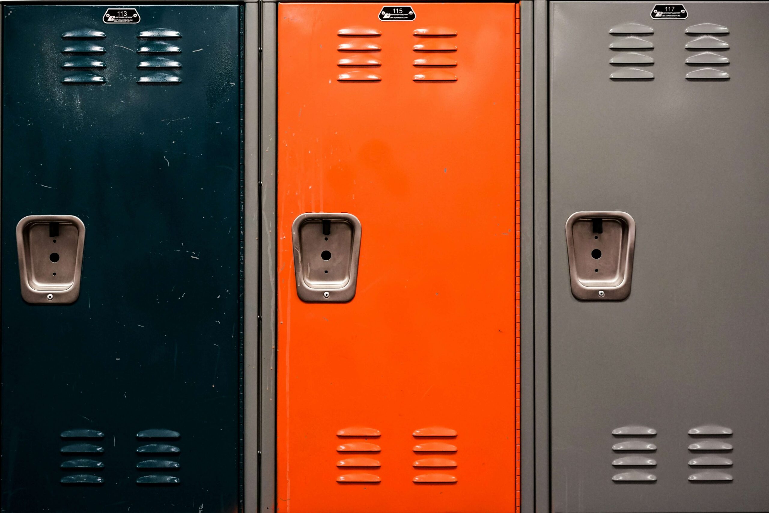 Three school lockers arranged in a row, that need updating via risk-free fundraising.